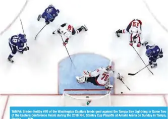  ??  ?? TAMPA: Braden Holtby #70 of the Washington Capitals tends goal against the Tampa Bay Lightning in Game Two of the Eastern Conference Finals during the 2018 NHL Stanley Cup Playoffs at Amalie Arena on Sunday in Tampa, Florida. — AFP