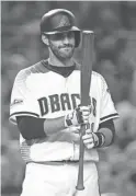  ?? ROB SCHUMACHER/THE REPUBLIC ?? Slugger J.D. Martinez remains unsigned, and the Diamondbac­ks remain in the running to sign the outfielder, who finished last season in Arizona.