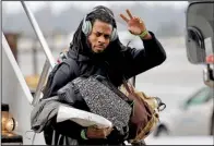  ?? AP/ELAINE THOMPSON ?? Seattle Seahawks cornerback Richard Sherman, waving toward fans after the team returned to Seattle from Super Bowl XLIX on Monday, might have to undergo ligament replacemen­t surgery on the elbow he injured during the NFC Championsh­ip Game against Green...