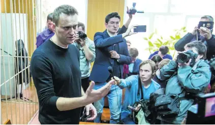  ?? Denis Tyrin / AP Photo ?? Opposition leader Alexei Navalny in a courtroom in Moscow, Russia, ahead of his 15-day sentence yesterday.