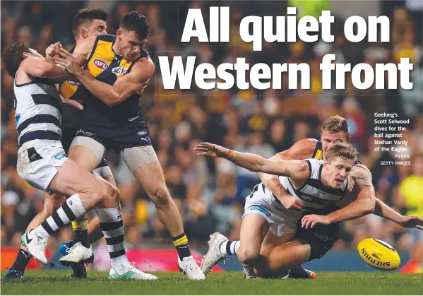  ?? Picture: GETTY IMAGES ?? Geelong’s Scott Selwood dives for the ball against Nathan Vardy of the Eagles.