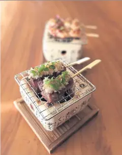  ?? ?? The Australian beef kushi with grated daikon and ponzu sauce and the chicken yakitori with yuzu salt and pepper.