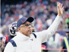  ?? BOB LEVEY/GETTY ?? Former Texans head coach David Culley waves to fans as he walks off the field after a 41-29 win against the Chargers on Dec. 26 at NRG Stadium in Houston.