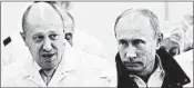  ?? ALEXEI DRUZHININ/SPUTNIK ?? Among those facing charges is Russian businessma­n Yevgeniy Prigozhin, left, a close associate of Vladimir Putin’s.