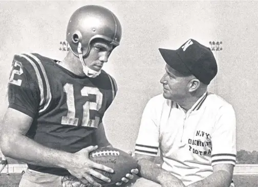  ?? 1963 PHOTO BY BILL ACHATZ, AP ?? Navy coach Wayne Hardin, right, and quarterbac­k Roger Staubach beat Army 15 days after President Kennedy was assassinat­ed.