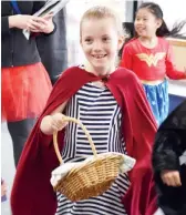  ??  ?? Skipping during a character parade is St Paul’s Year 2 student, Paige Butters as Little Red Riding Hood for Book Week.