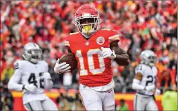  ?? Kansas City STAR/TNS ?? Kansas City Chiefs wide receiver Tyreek Hill trots into the end zone to score against the Oakland Raiders on Dec. 30 at Arrowhead Stadium in Kansas City, Mo.