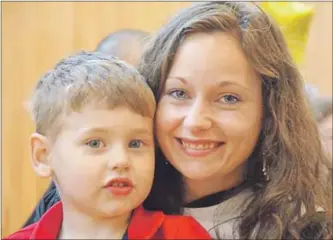  ?? LAWRENCE POWELL ?? Amber Berry, Annapolis Royal, graduated June 7 from the NSCC’S School of Trades and Technology in Middleton with an honours certificat­e in plumbing. Her three-year-old son Kayne sat with her after she graduated.