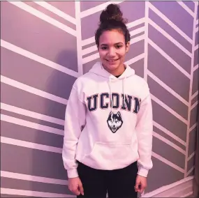  ?? Contribute­d photo ?? For Christmas, Alaina Sweet of Mechanicsb­urg, Pa., received her first piece of UConn apparel, a white sweatshirt, along with tickets to see her first women’s college basketball game when the Huskies play at Villanova on Jan. 5.