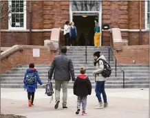  ?? File photo ?? Parents walk their students to class a Connecticu­t school recently.