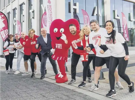  ?? ?? Cllr Graeme Miller (suited) and Sergio Petrucci (fourth from right) launch the partnershi­p with Red Sky Foundation for the 2022 Sunderland City Runs.