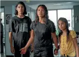  ??  ?? Gina Rodriguez, centre, is determined to keep her children, Lucius Hoyos, left, and Ariana Greenblatt.