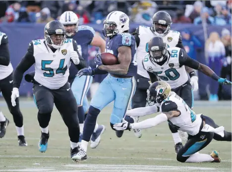  ?? JAMES KENNEY/AP ?? Canadian Eli Ankou, left, a Jacksonvil­le Jaguars defensive lineman, has made an impact with the NFL playoff team in his rookie year.