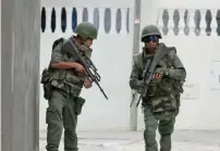  ?? — Reuters file ?? Tunisian soldiers patrol a residence in Oued Ellil, west of Tunis.