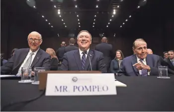  ?? GETTY IMAGES ?? From left, Sen. Pat Roberts (R-Kan.), Rep. Mike Pompeo (R-Kan.) and former Sen. Bob Dole (R-Kan.) take their seats during Pompeo’s Jan. 12 committee hearing to be the director of the CIA. Pompeo was sworn in Monday night.