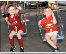  ?? Photo by Michelle Cooper Galvin ?? Fionn and Oisin Bevan, Milltown, enjoying the craic in Milltown on Saturday.