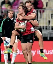  ?? GETTY IMAGES ?? George Bridge, left, and Israel Dagg, pictured celebratin­g during the Crusaders’ Super Rugby game against the Blues in Christchur­ch last year, will hope to help their team claim another Super Rugby title this year.