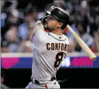  ?? DAVID BERDING/GETTY IMAGES ?? The Giants’ Michael Conforto hits a two-run home run again on Tuesday.