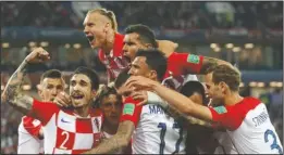  ?? The Associated Press ?? SQUAD GOALS: Croatia’s players celebrate after teammate Luka Modric scored from a penalty spot during their 2-0 Group D win against Nigeria Saturday at the 2018 FIFA World Cup in the Kaliningra­d Stadium in Kaliningra­d, Russia.