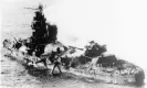  ?? Photograph: AP ?? Japanese heavy cruiser of the Mogami class lies low in the water after being bombed by US naval aircraft during the Battle of Midway.