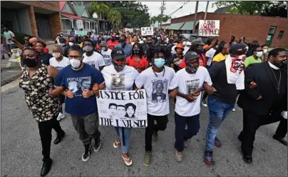  ?? The Associated Press ?? MARCH: Protesters march after a rally at the Glynn County Courthouse to protest the shooting of Ahmaud Arbery on Saturday in Brunswick, Ga.