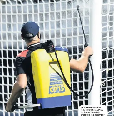  ??  ?? CLEAN UP Staff on duty at St Mirren Park as part of Covid-19 protocols in September