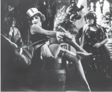  ?? FOTOS: DPA ?? Mit Zylinder, Strapsen und laszivem Blick wurde sie zum Weltstar: Marlene Dietrich im Film „Blauer Engel“von 1929. Die 1920er- und 1930er-Jahre gelten als die produktivs­te Zeit der Ufa.