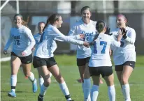  ?? JON CUNNINGHAM/DAILY SOUTHTOWN ?? Madison Dziedzic, far right, celebrates with her Lincoln-Way East teammates after scoring against Lockport during Tuesday’s game. Lincoln-Way East defeated the Porters 3-1.