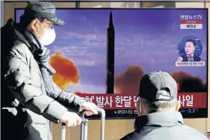  ?? REUTERS ?? A man walks past a TV broadcasti­ng a news report on North Korea firing a ballistic missile off its east coast in Seoul, South Korea yesterday.