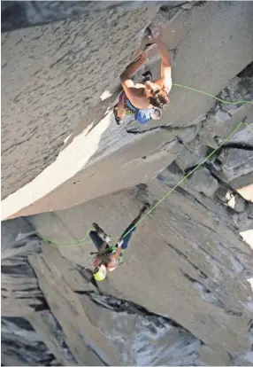  ??  ?? Alex Honnold, top, and Tommy Caldwell climb The Nose of El Capitan in Yosemite National Park on Sunday. The two broke their own record on Wednesday, making the climb in less than two hours. COREY RICH/ REEL ROCK / NOVUS SELECT VIA AP