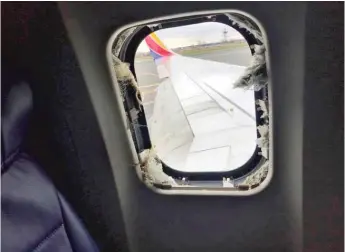  ?? MARTY MARTINEZ VIA AP ?? This photo shows the window that was shattered after a jet engine of a Southwest Airlines plane blew out. A woman died after she was nearly sucked through the window during the flight.