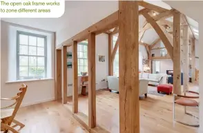  ??  ?? The open oak frame works to zone different areas