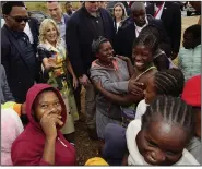  ?? (AP/Dirk Heinrich) ?? U.S. First Lady Jill Biden (top left) reacts during a visit to the informal settlement of Katutura, Windhoek, Namibia, on Thursday.