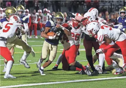  ?? WILLIAM BRETZGER/DELAWARE NEWS JOURNAL ?? Salesianum’s B.J. Alleyne scores the game-winning touchdown with three seconds on the clock in Salesianum’s 41-40 win in the first round of the DIAA Class 3A tournament on Friday at Abessinio Stadium.