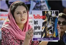  ?? Anjum Naveed/Associated Press ?? An Afghan refugee woman takes part in a rally to mark Internatio­nal Women’s Day in Pakistan.