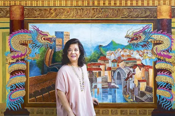  ??  ?? Elena Coyiuto, businesswo­man-turned-artist with her painting “In Search of Shangri-La.” Elena is mounting her first one-woman exhibit at Finale Art Gallery on Pasong Tamo, Makati, on July 29. Part of the proceeds of the exhibit goes to National Book...