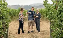  ?? BRADEN FASTIER/STUFF ?? Seifried Estates winemakers Heidi Seifried-Houghton and Chris Seifried and European market manager Marie O’Riordan at the newly acquired sauvignon blanc vineyard in Hope.