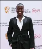 ?? ?? Ncuti Gatwa poses for photograph­ers upon arrival for the British Academy Television Awards in London in 2021. Gatwa will take the mantle from Jodie Whittaker on “Doctor Who,” the BBC announced on Sunday, ending speculatio­n over the iconic Time Lord’s next regenerati­on.