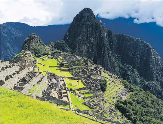  ?? PHOTOS: SHARON LINDORES ?? Peru’s famed Machu Picchu rises about 2,400 metres above sea level in the Andes Mountains. Locals recommend cocoa tea to help with altitude sickness.