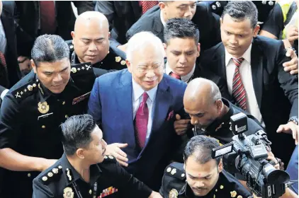  ?? PHOTO: REUTERS ?? Facing the music . . . Former Malaysian prime minister Najib Razak arrives in court in Kuala Lumpur, Malaysia, yesterday.