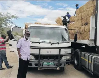  ?? Photo: Contribute­d ?? Much-needed… Labour official Alfred Angula with his donation of bales of lucerne.