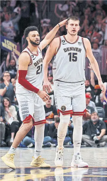  ?? USA TODAY SPORTS ?? The Nuggets’ Jamal Murray, left, and Nikola Jokic react during a play-off game last month.