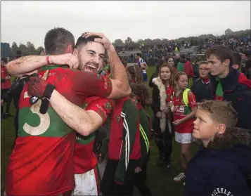  ??  ?? Eddie Doyle and Damien Power embrace after the final whistle in Joule Park, Aughrim.