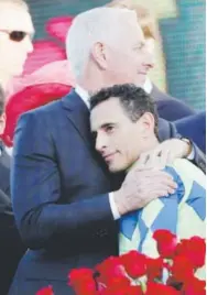  ?? Jamie Squire, Getty Images ?? Always Dreaming’s trainer, Todd Pletcher, celebrates the horse’s victory with jockey John Velazquez at Churchill Downs on Saturday.