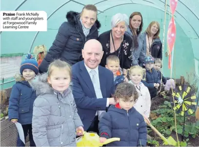  ??  ?? Praise Frank McNally with staff and youngsters at Forgewood Family Learning Centre