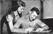  ??  ?? Mickey Mantle signs his baseball contract with the New York Yankees on Feb. 9, 1953, as his wife looks on. [AP FILE PHOTO]