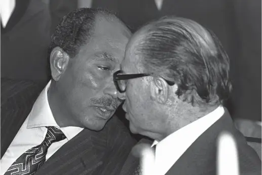  ?? (Reuters) ?? EGYPTIAN PRESIDENT Anwar Sadat talks to Prime Minister Menachem Begin during his visit to Jerusalem in 1977.