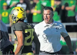  ??  ?? Under head coach Mario Cristobal, right, Oregon has held its first three conference opponents to under 10 points for the first time since 1933.