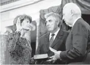  ?? ALEX BRANDON/AP2015 ?? Then-Vice President Joe Biden administer­s the oath of office to Sen. Lisa Murkowski at a mock swearing-in. Verne Martell, center, is Murkowski’s husband.