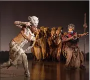  ??  ?? Nia Holloway, as Nala, and Buyi Zama, as Rafiki, perform in “The Lion King.”